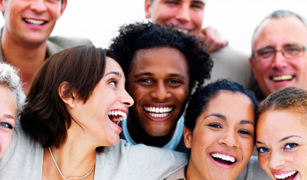 Closeup portrait of a group of business people laughing - Evoloshen